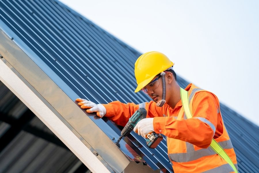 Construction Worker Installing a New Roof